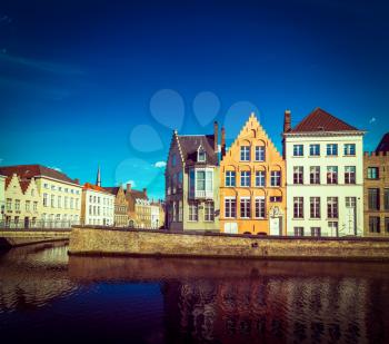 Vintage retro hipster style travel image of Europe town travel background - canal and medieval houses. Bruges (Brugge), Belgium