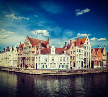 Vintage retro hipster style travel image of Benelux travel  concept background - Bruges canal and medieval houses. Brugge, Belgium