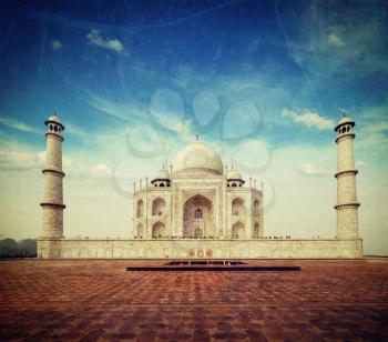 Vintage retro hipster style travel image of 
Taj Mahal. Indian Symbol - India travel background with grunge texture overlaid. Agra, India