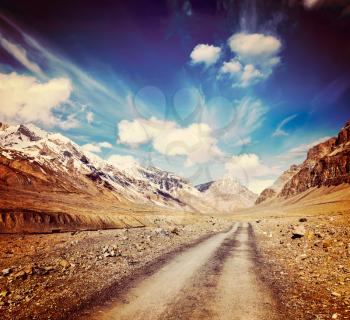 Vintage retro effect filtered hipster style travel image of Road in mountains Himalayas. Spiti Valley,  Himachal Pradesh, India