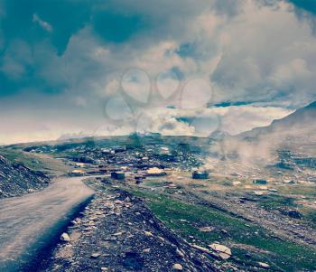 Vintage retro effect filtered hipster style travel image of Road in Himalayas on top of  Rohtang La pass, Himachal Pradesh, India
