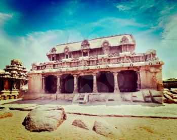 Vintage retro hipster style travel image of Five Rathas - ancient Hindu monolithic Indian rock-cut architecture. Mahabalipuram, Tamil Nadu, South India