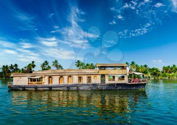 Travel tourism Kerala background - houseboat on Kerala backwaters. Kerala, India