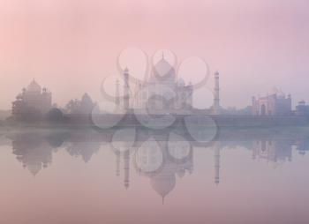 Taj Mahal on sunrise sunset reflection in Yamuna river panorama in fog, Indian Symbol - India travel background. Agra, Uttar Pradesh, India