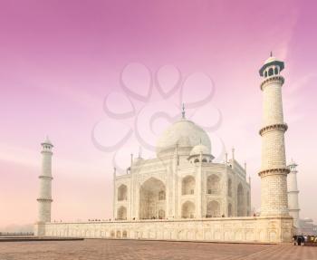 Taj Mahal on sunrise. Indian Symbol - India travel background. Agra, India