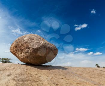 Krishna's butterball -  balancing giant natural rock stone. Mahabalipuram, Tamil Nadu, India