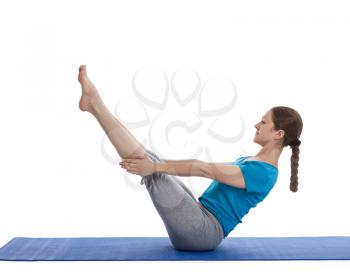 Yoga - young beautiful woman yoga instructor doing Full Boat pose asana (Paripurna navasana) exercise isolated on white background