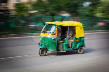 Indian auto (autorickshaw) taxi in the street. Motion blur. India