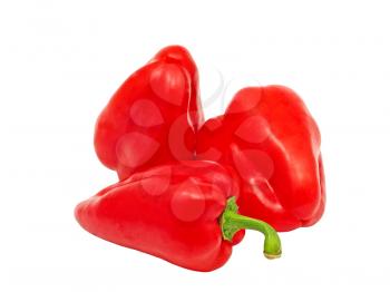 Three sweet red peppers isolated on a white background.
