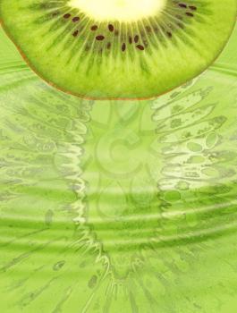 Half of ripe green kiwi slice on green abstract background.Digitally generated image.