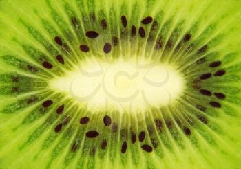 Fresh green kiwi taken closeup suitable as food background.