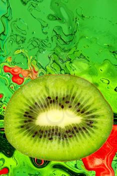 Slice of kiwi taken closeup on abstract background.Digitally generated image.