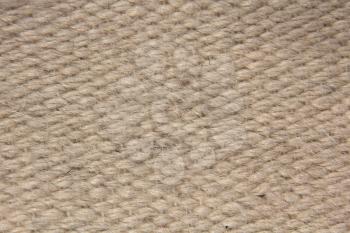 Rough camel wool fabric texture taken closeup suitable as background.