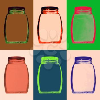 Set of multicolored empty glass jar on color background.