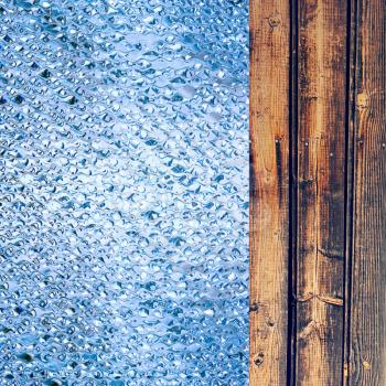Azure drips and wooden timber as abstract background.Digitally generated image.