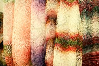 Color shawls taken closeup hanging for sale.Toned image.