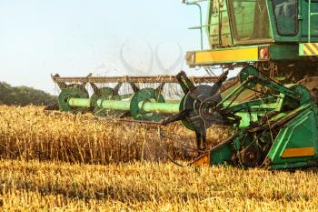 Combine harvester in agriculture field taken closeup.