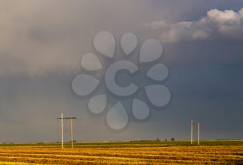 Storm Clouds Saskatchewan with swathed farrnland in foreground