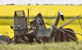 Vintage Farm Equipment against Canalo Background Canada