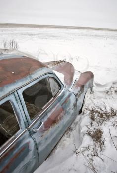 Antique abandoned car pontiac in winter canada