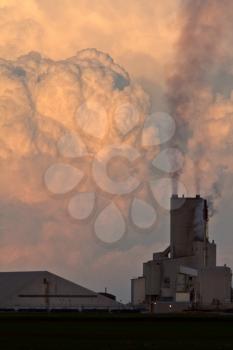 Cumulonimbus clouds behind Saskferco potash plant