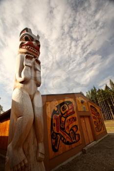 Totem pole outside native lodge at Kitsumkalum Provincial Park