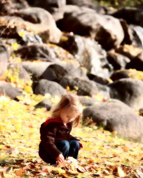 Young girl in park in autumn
