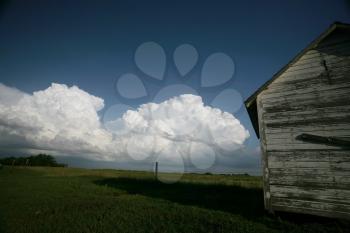 Storm clouds behind old Saskatchewan granary