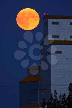 Full moon behind Tuxford grain elevator