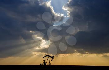 Prairie Storm Clouds Saskatchewan oil pump jack