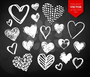Vector white chalk drawn collection of grunge Valentine hearts on blackboard background.