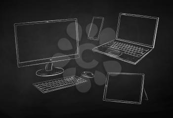 Vector black and white chalk drawn illustration of computer devices on black chalkboard background.