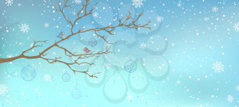 Tree branch and birds on it. Snowfall and Christmas decorations on the tree. There is place for your text in the sky. 