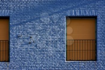 old yellow window in light blue wall in the centre of la boca buenos aires argentina