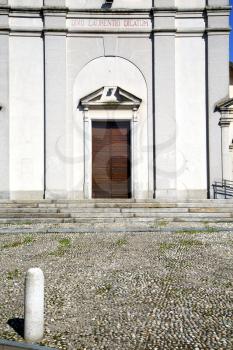 italy  sumirago church  varese  the old door entrance and mosaic sunny daY 
