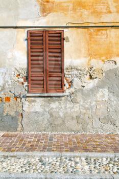 red window  varano borghi palaces italy   abstract  sunny day    wood venetian blind in the concrete  brick  
