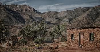 blur  in lesotho malealea street village near  mountain  and coultivation field