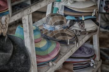 blur  in  philippines  lots of fashion trandy hats in a market like souvenir