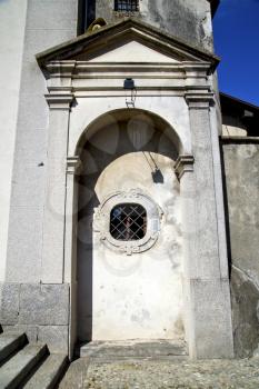   italy  sumirago church  varese  the old door entrance and mosaic sunny daY 