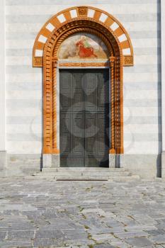 door   in italy  lombardy   column  the milano old   church   closed brick  pavement