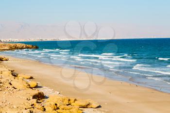 near sandy beach sky and  mountain  in oman arabic sea   the hill 