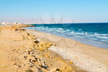 near sandy beach sky and  mountain  in oman arabic sea   the hill 