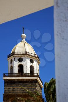 in teguise  arrecife lanzarote  spain the old wall terrace church bell tower plant
