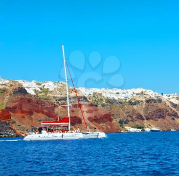 from    boat   in europe greece santorini island house and rocks the sky