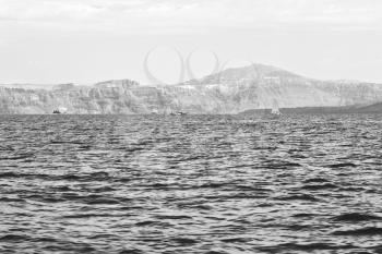 from    boat    in europe greece santorini island house and rocks the sky