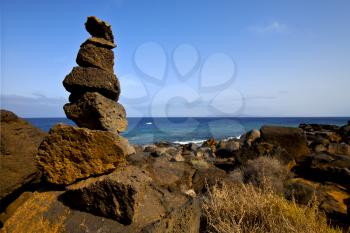 rock spain landscape  stone sky cloud beach   water  in lanzarote  isle 
