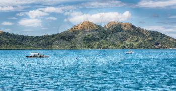 from a boat  in  philippines  snake island near el nido palawan beautiful panorama coastline sea and rock 