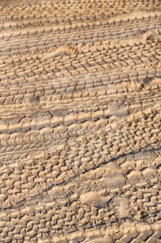 in the desert  beach track of car and truck in the sand like abstract background