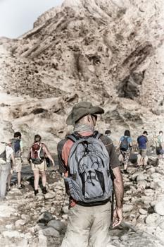 in   ethiopia africa   lots of people  hiking in the  canyon empty river