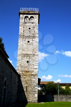  italy  lombardy     in  the arsago seprio    old   church   closed brick tower  wall grass